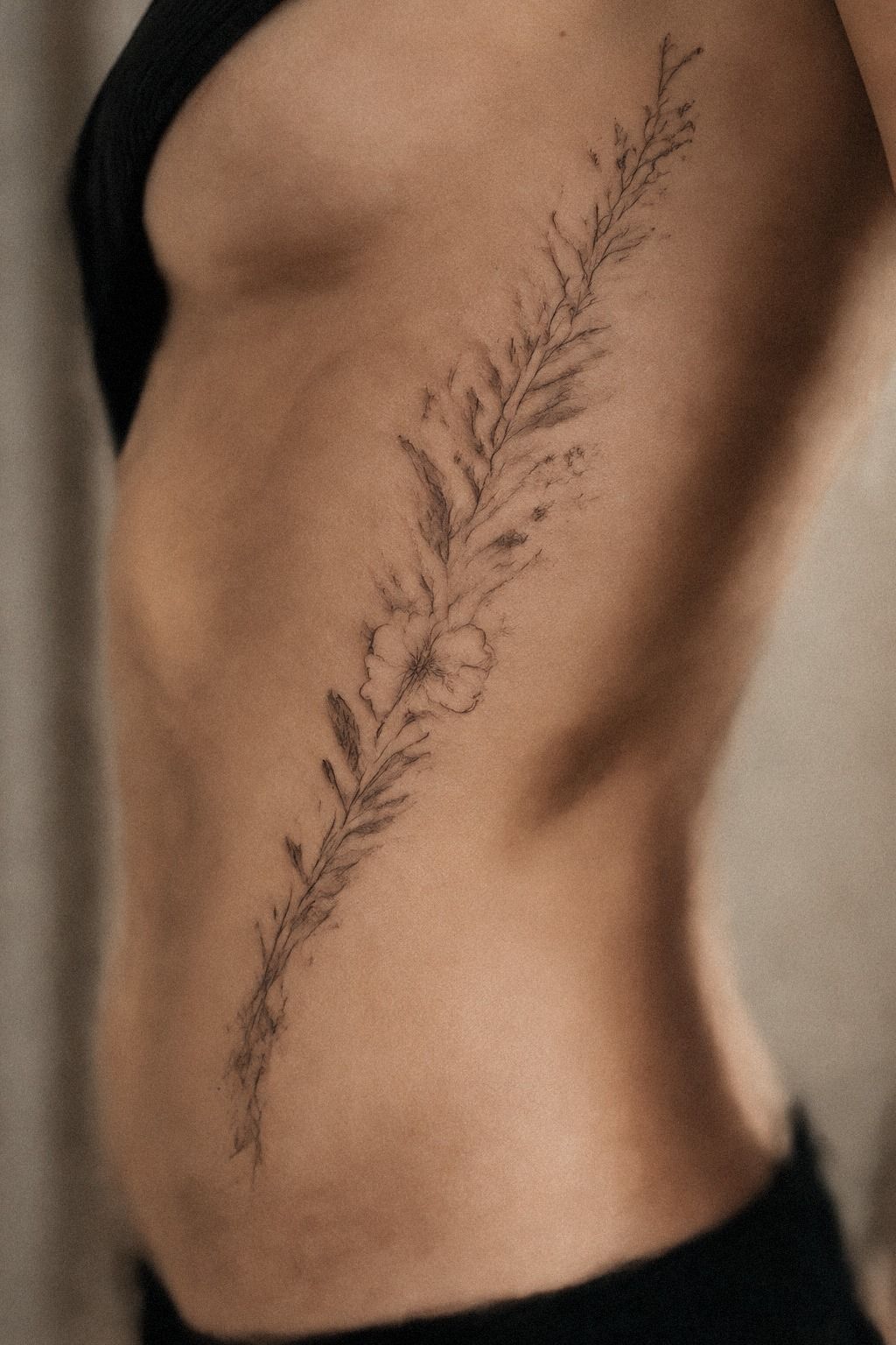 Let a Delicate Floral Spine Tattoo Follow the Centerline