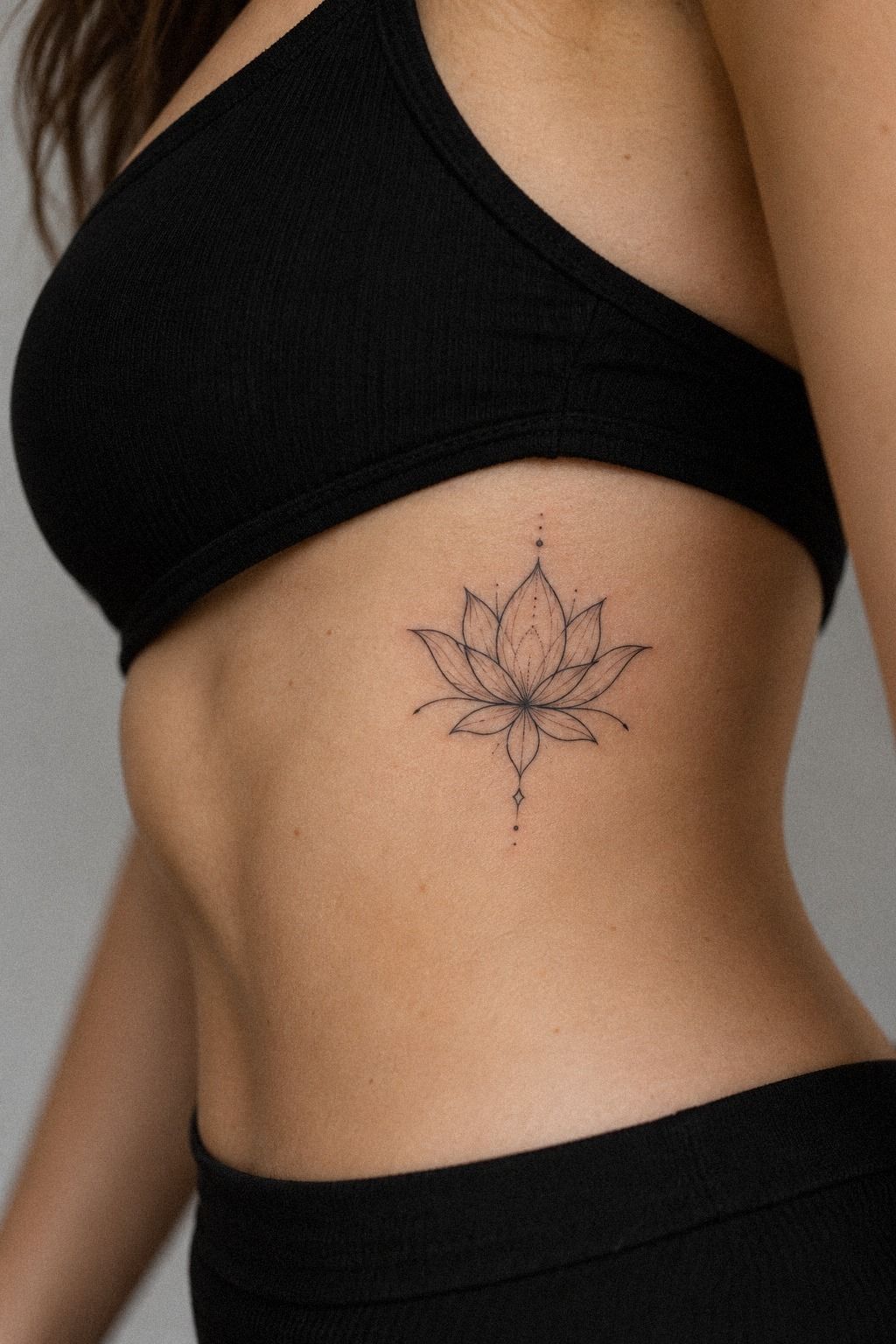 Small Fine Line Lotus Tattoo on the Wrist