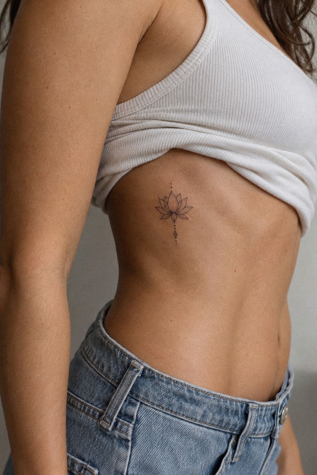 Fine Line Lotus Tattoo with Crescent Moon Details