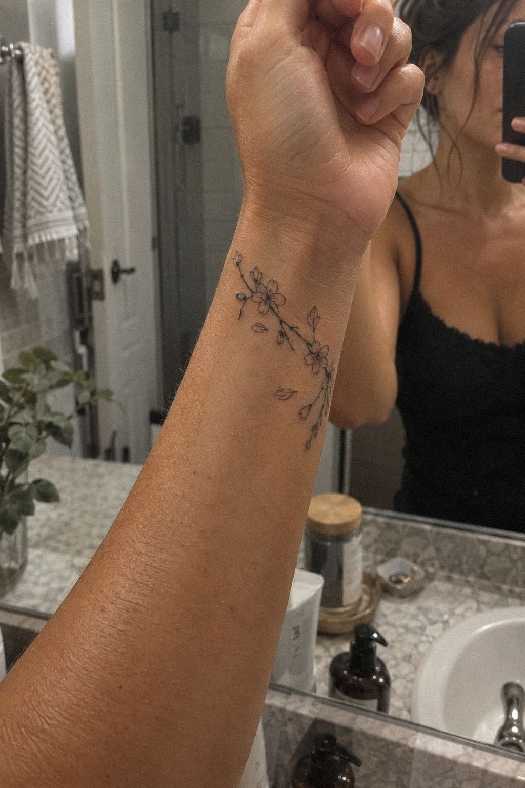 Unique Tiny Cherry Blossom Tattoo on the Wrist